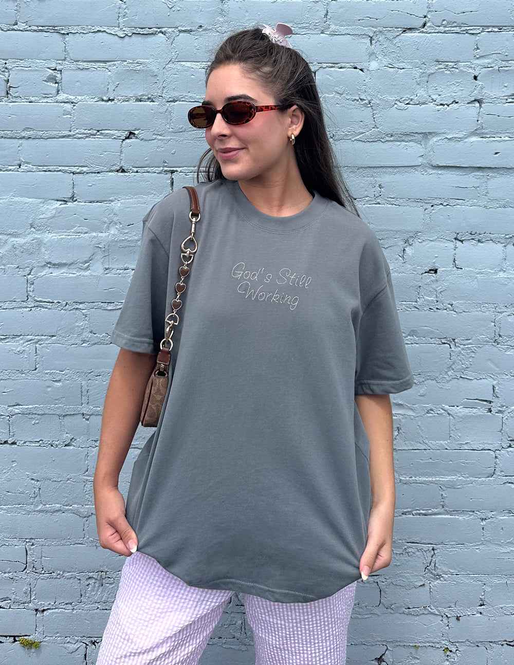 God's Still Working Unisex Tee